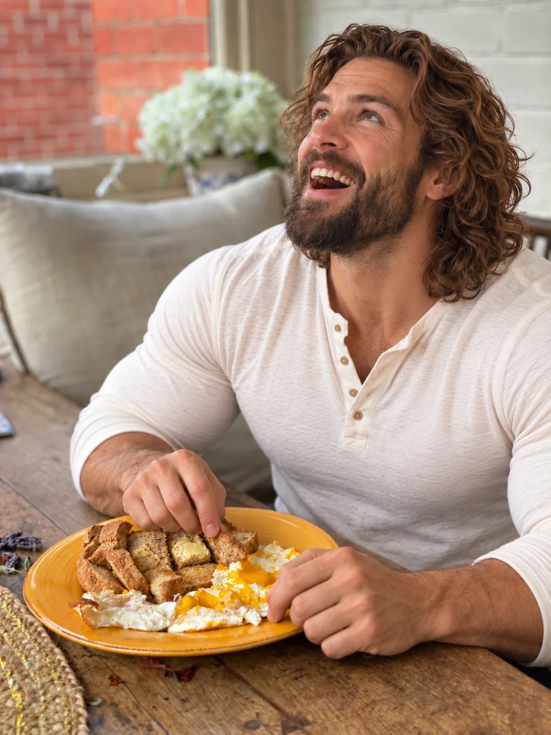 Husband laughing over breakfast at a wooden table
